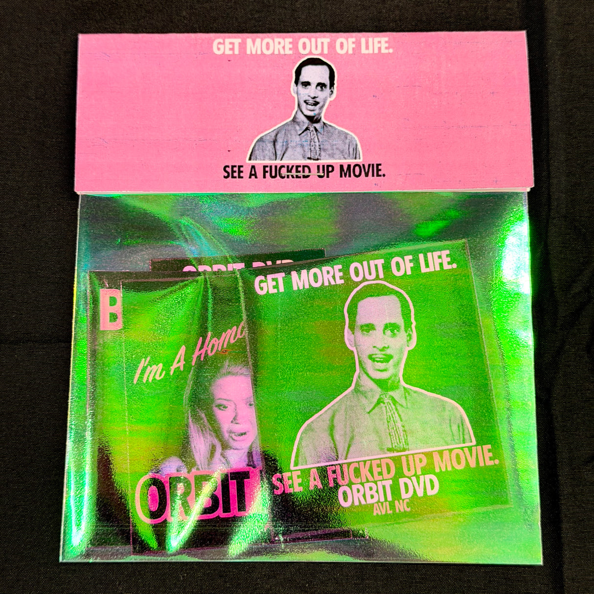Packaged DVD with text and images on a black background