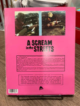 A SCREAM IN THE STREETS W/SLIP USED