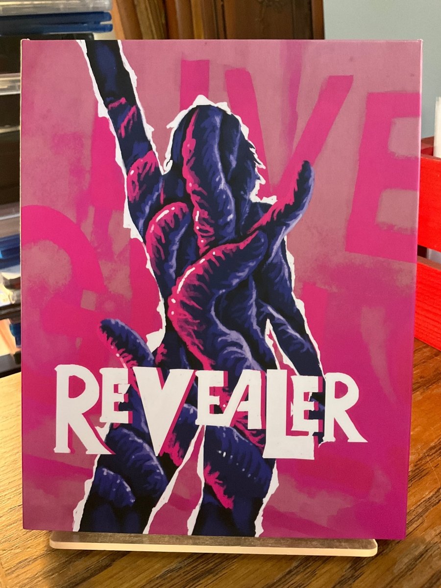 Revealer w/SLIP AND BOOKLET USED